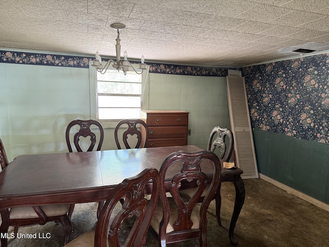 carpeted dining space featuring a chandelier