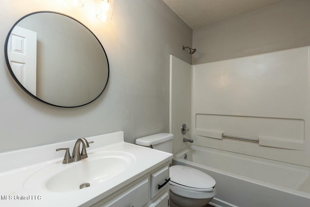 full bathroom with shower / tub combination, a textured ceiling, toilet, and vanity