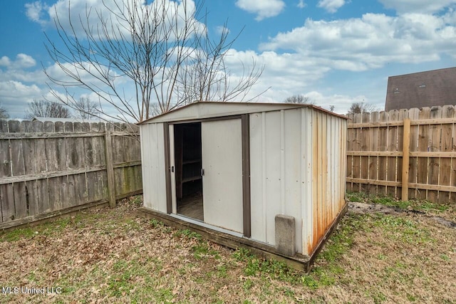 view of shed featuring a fenced backyard