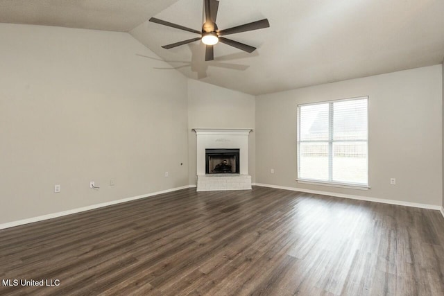 unfurnished living room with baseboards, a ceiling fan, lofted ceiling, dark wood-style floors, and a fireplace