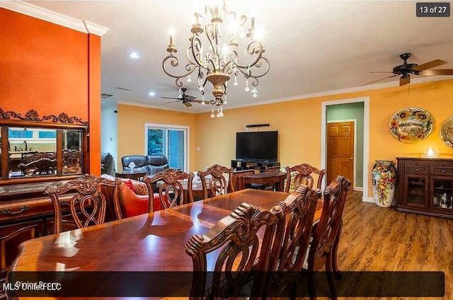 dining space featuring crown molding, ceiling fan with notable chandelier, and light hardwood / wood-style floors