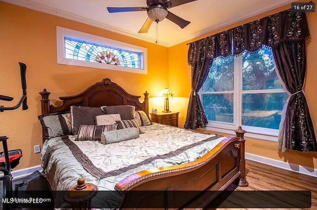bedroom featuring ornamental molding and wood-type flooring