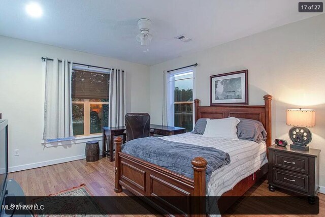 bedroom featuring light hardwood / wood-style flooring and ceiling fan