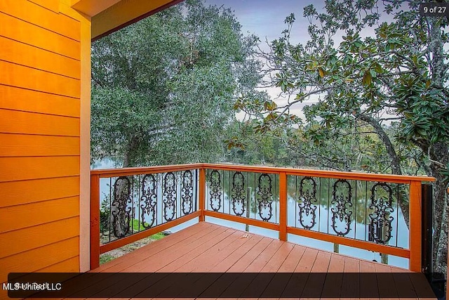 wooden deck with a water view