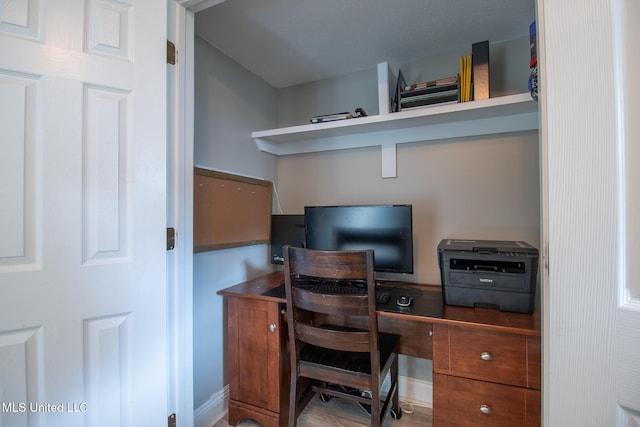 office space with hardwood / wood-style floors