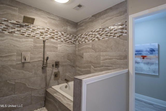 bathroom featuring separate shower and tub and hardwood / wood-style flooring