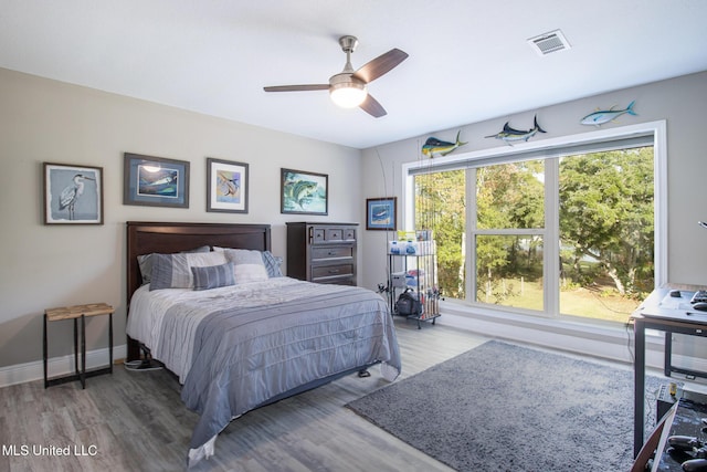 bedroom featuring ceiling fan and wood-type flooring