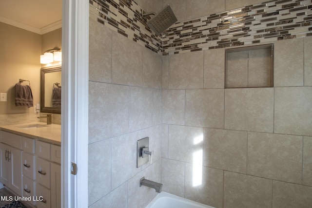 bathroom with shower / washtub combination, vanity, and ornamental molding