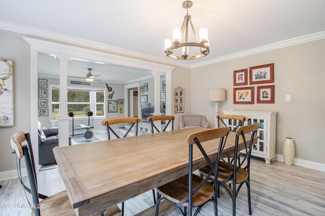 dining space featuring ceiling fan with notable chandelier, light wood-type flooring, and crown molding