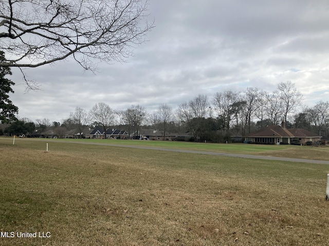 surrounding community featuring a lawn