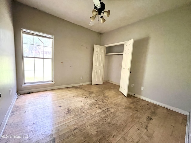 231 Clark Farms Rd, Madison, MS 39110 - unfurnished bedroom featuring wood-type flooring, baseboards, and a ceiling fan