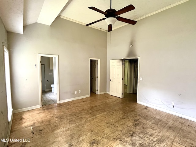 231 Clark Farms Rd, Madison, MS 39110 - unfurnished bedroom with high vaulted ceiling, wood finished floors, baseboards, connected bathroom, and a ceiling fan
