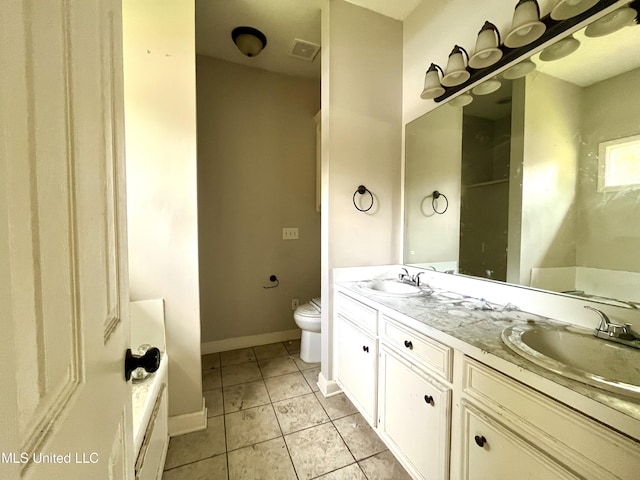 231 Clark Farms Rd, Madison, MS 39110 - full bath featuring toilet, double vanity, tile patterned flooring, and baseboards