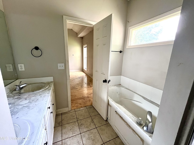 231 Clark Farms Rd, Madison, MS 39110 - bathroom featuring double vanity, a bath, and tile patterned floors