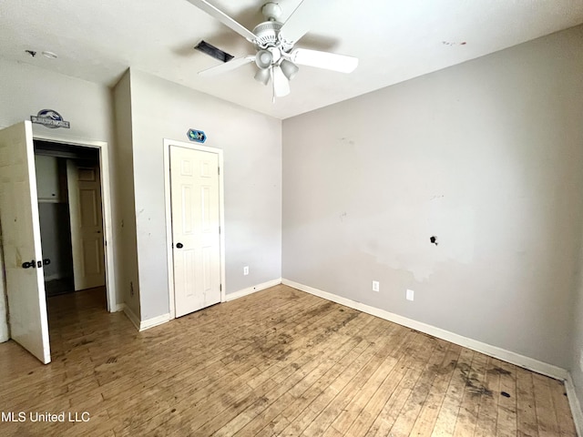 231 Clark Farms Rd, Madison, MS 39110 - unfurnished bedroom featuring baseboards, hardwood / wood-style floors, and a ceiling fan