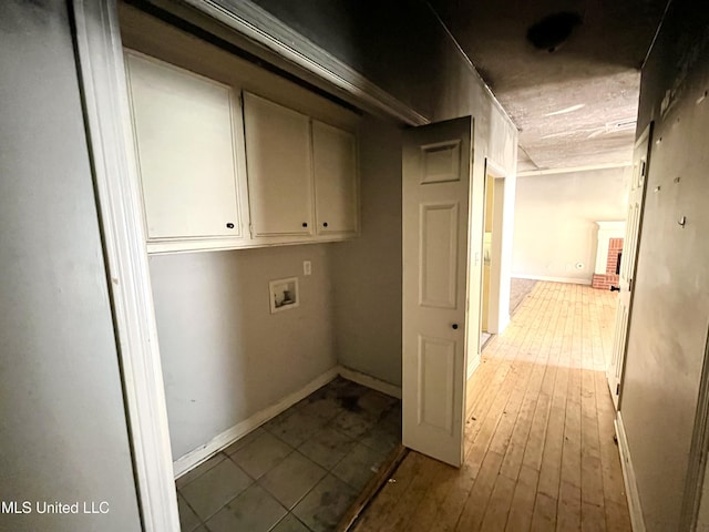 231 Clark Farms Rd, Madison, MS 39110 - laundry area featuring cabinet space, washer hookup, baseboards, and hardwood / wood-style floors