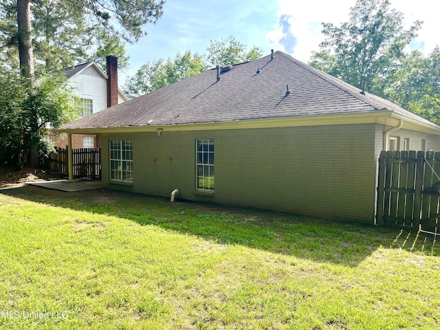 231 Clark Farms Rd, Madison, MS 39110 - rear view of property with brick siding, roof with shingles, and a chimney