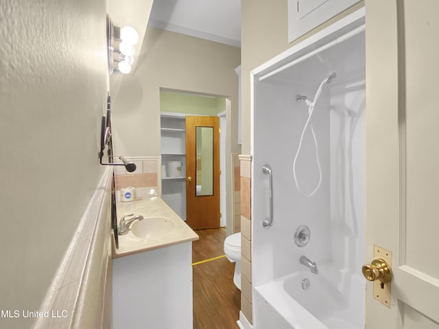 full bathroom featuring toilet, vanity, shower / bathtub combination, and hardwood / wood-style floors