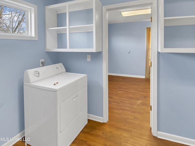 washroom with washer / dryer and hardwood / wood-style flooring