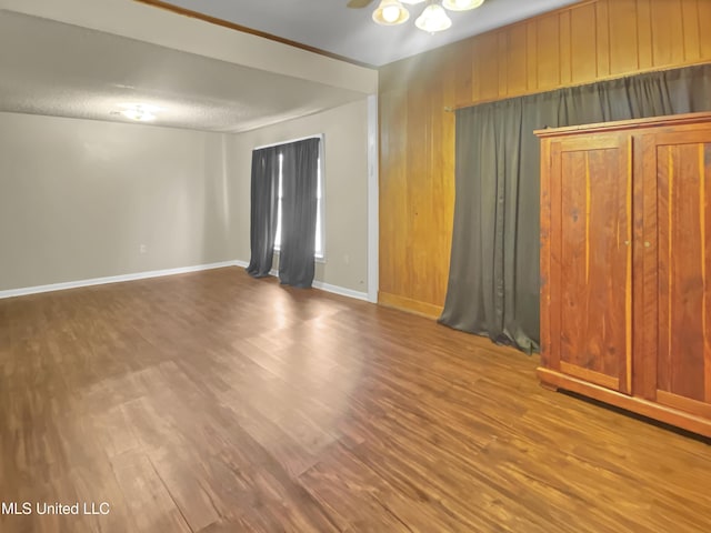 empty room with hardwood / wood-style flooring