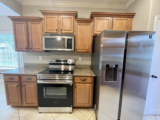 7309 Gerralyn Cv, Olive Branch, MS 38654 - kitchen with appliances with stainless steel finishes, light stone countertops, ornamental molding, light tile patterned floors, and brown cabinets