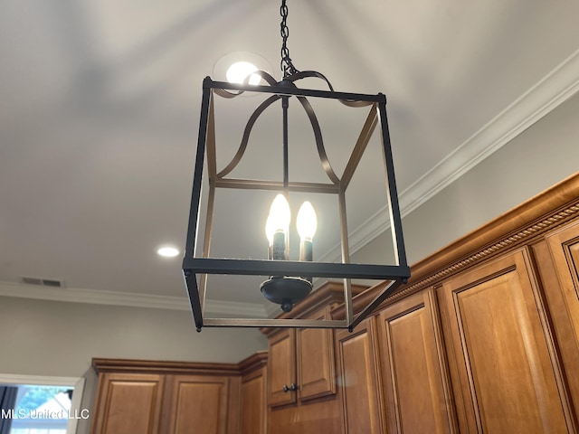 7309 Gerralyn Cv, Olive Branch, MS 38654 - detailed view of a chandelier, brown cabinetry, and ornamental molding