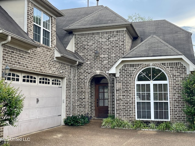 7309 Gerralyn Cv, Olive Branch, MS 38654 - view of front of property with brick siding, concrete driveway, and roof with shingles
