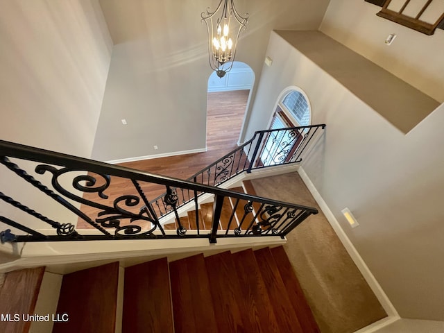 7309 Gerralyn Cv, Olive Branch, MS 38654 - stairs with a chandelier and baseboards