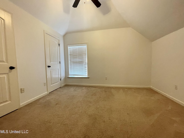 7309 Gerralyn Cv, Olive Branch, MS 38654 - unfurnished bedroom featuring vaulted ceiling, carpet flooring, and ceiling fan