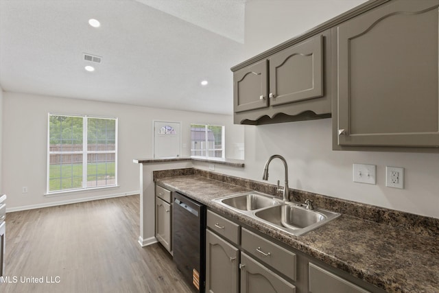 7306 George Ln, Horn Lake, MS 38637 - kitchen featuring stainless steel dishwasher, a sink, gray cabinets, dark countertops, and recessed lighting