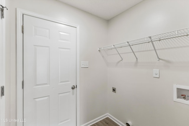 7306 George Ln, Horn Lake, MS 38637 - laundry room featuring electric dryer hookup, washer hookup, baseboards, and dark wood-style flooring