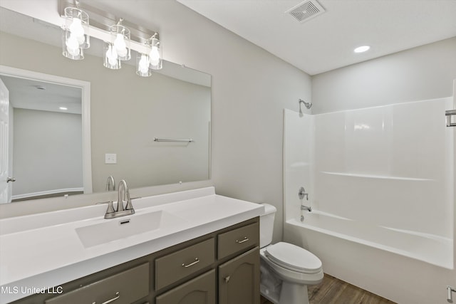 7306 George Ln, Horn Lake, MS 38637 - full bathroom featuring wood finished floors, vanity, toilet, shower / bathtub combination, and recessed lighting