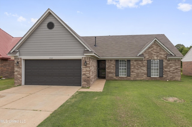 7306 George Ln, Horn Lake, MS 38637 - view of front of property featuring brick siding, a front yard, driveway, and a garage