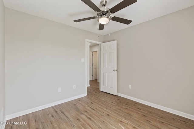 7306 George Ln, Horn Lake, MS 38637 - spare room featuring light wood-style floors, baseboards, and ceiling fan