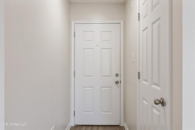 7306 George Ln, Horn Lake, MS 38637 - doorway featuring baseboards and wood finished floors