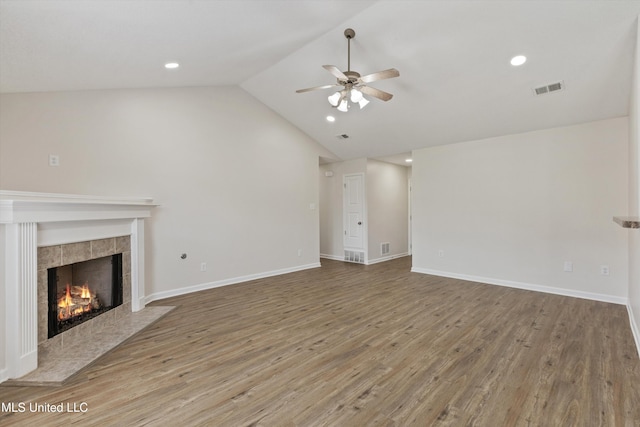 7306 George Ln, Horn Lake, MS 38637 - unfurnished living room with a ceiling fan, a fireplace, wood finished floors, vaulted ceiling, and recessed lighting