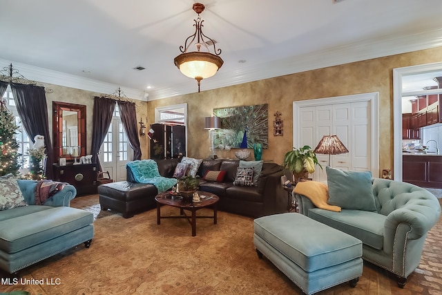 living room with french doors and ornamental molding