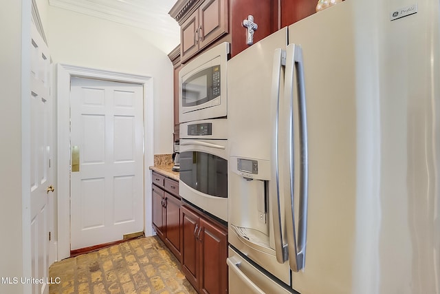 kitchen featuring appliances with stainless steel finishes and crown molding