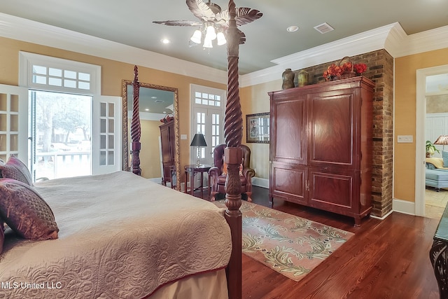 bedroom with dark hardwood / wood-style flooring, ceiling fan, and ornamental molding