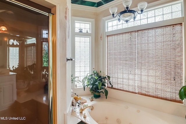 bathroom with plus walk in shower, an inviting chandelier, and ornamental molding