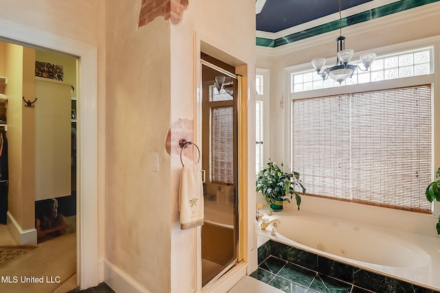 bathroom with shower with separate bathtub, crown molding, and a chandelier