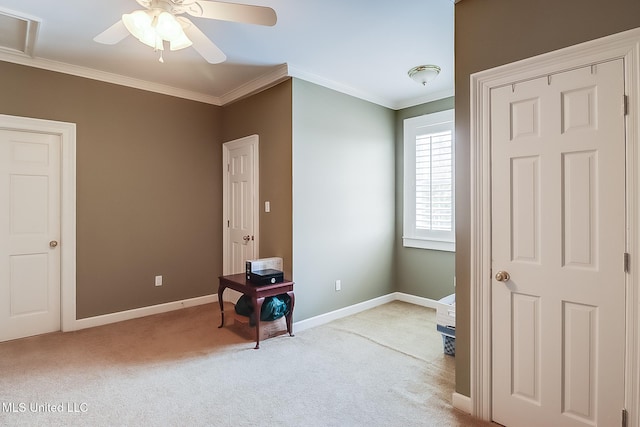 bedroom with light carpet, ceiling fan, and crown molding