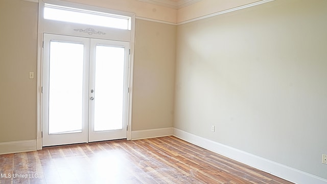 30 Oak Alley Ln, Long Beach, MS 39560 - unfurnished room with french doors, wood finished floors, and ornamental molding