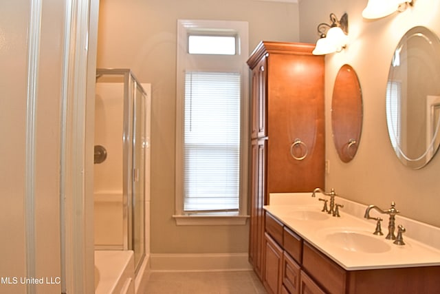 30 Oak Alley Ln, Long Beach, MS 39560 - full bath with a shower with door, double vanity, tile patterned flooring, and healthy amount of natural light