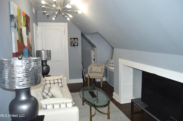 living area featuring dark hardwood / wood-style flooring, vaulted ceiling, and a notable chandelier