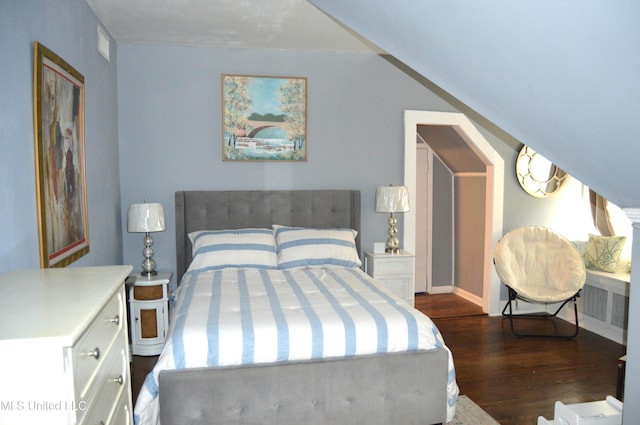 bedroom featuring dark hardwood / wood-style floors