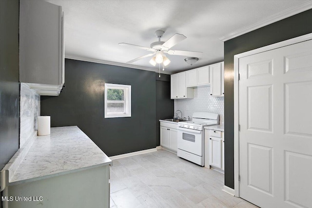 kitchen featuring sink, decorative backsplash, white cabinets, and white stove