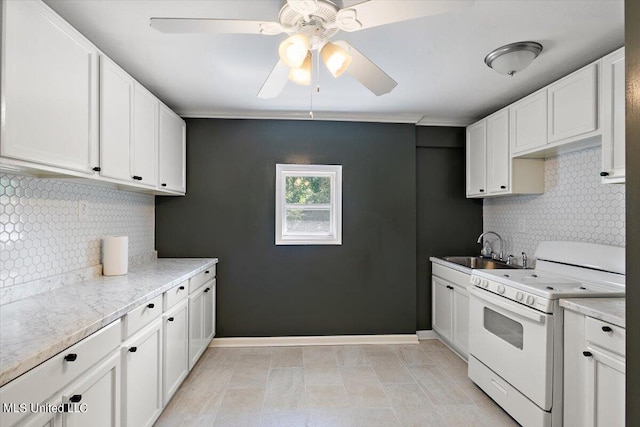 kitchen featuring backsplash, white stove, sink, and white cabinets