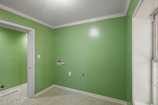 washroom with ornamental molding and a textured ceiling