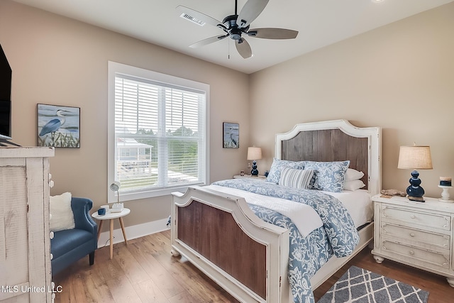 118 Sea Oaks Blvd, Long Beach, MS 39560 - bedroom with multiple windows, wood finished floors, baseboards, and ceiling fan